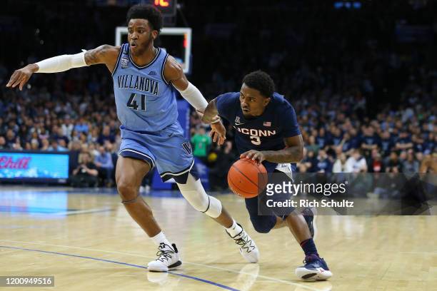 Alterique Gilbert of the Connecticut Huskies in action against Saddiq Bey of the Villanova Wildcats during a college basketball game at Wells Fargo...