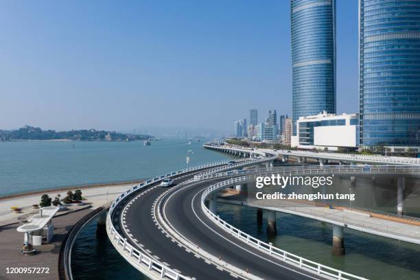 viaduct road view beside coastline, xiamen, china. - atlantic blue tang stock pictures, royalty-free photos & images