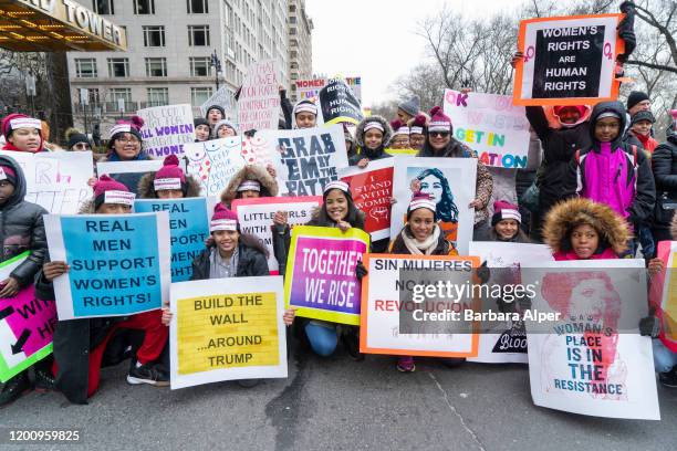 The 4th Annual Women's March gathered at Columbus Circle in NYC, January 18, 2020. This group were all wearing headbands saying "This Is What...