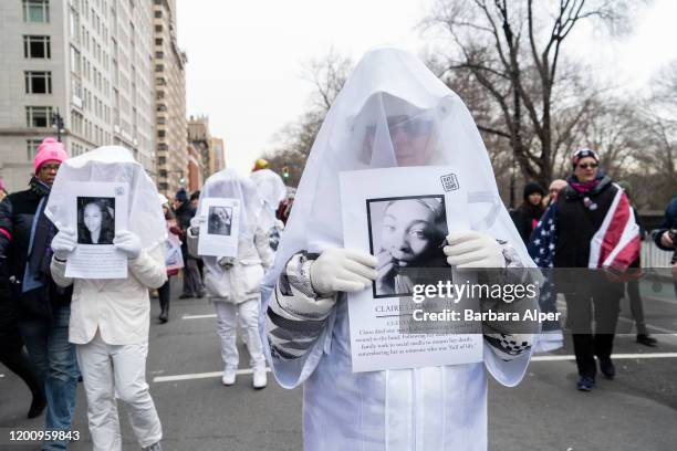 The group Gays Against Guns marched in The 4th Annual Women's March gathered at Columbus Circle in NYC, January 18, 2020. They held photos of LGBTQ...