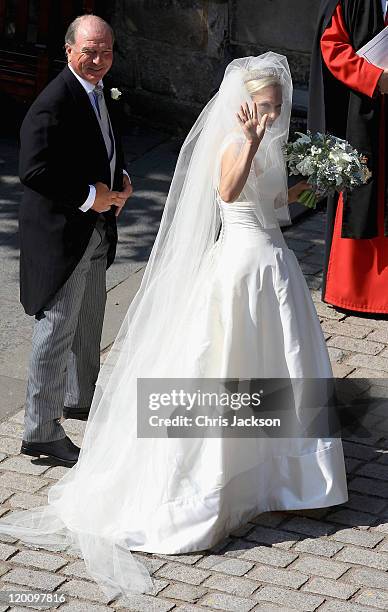 Zara Philips and Captain Mark Philips arrive at Canongate Kirk on the afternoon of her wedding to Mike Tindall on July 30, 2011 in Edinburgh,...