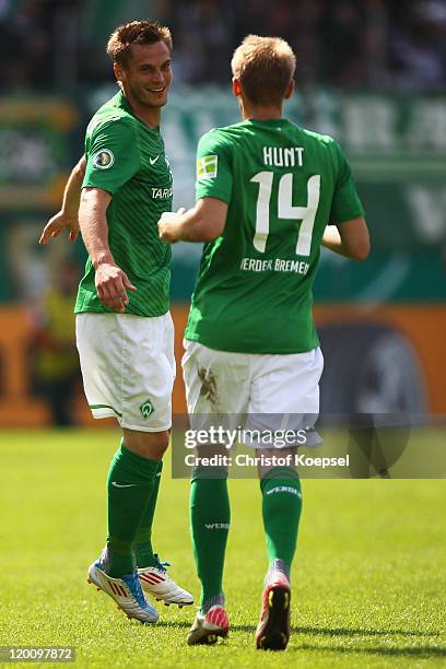 Markus Rosenberg of Bremen celebrates the first goal with Aaron Hunt during the first round DFB Cup match between 1. FC Heidenheim and Werder Bremen...