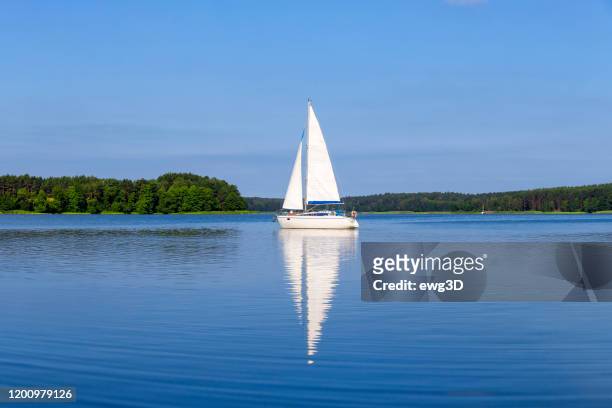vacation in poland - sailboat on the niegocin lake, masuria - sail stock pictures, royalty-free photos & images
