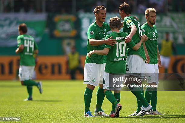 Markus Rosenberg of Bremen celebrates the first goal with Marko Marin, Tim Borowski and Aaron Hunt of Bremen during the first round DFB Cup match...