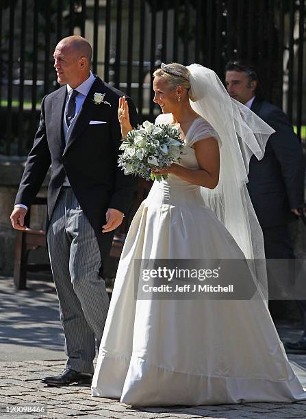 Mike Tindall and Zara Phillips depart after their Royal wedding at Canongate Kirk on July 30, 2011 in Edinburgh, Scotland. The Queen's granddaughter...