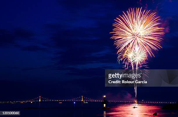 fireworks by bridge - rolour garcia stock pictures, royalty-free photos & images