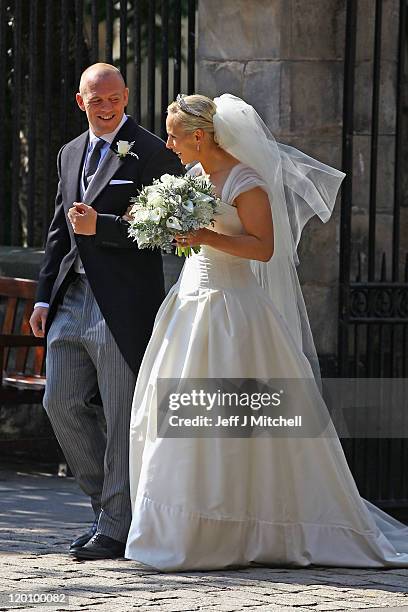 Mike Tindall and Zara Phillips depart after their Royal wedding at Canongate Kirk on July 30, 2011 in Edinburgh, Scotland. The Queen's granddaughter...