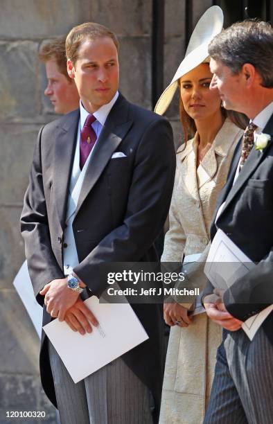 Prince William, Duke of Cambridge and Catherine, Duchess of Cambridge depart after the Royal wedding of Zara Phillips and Mike Tindall at Canongate...