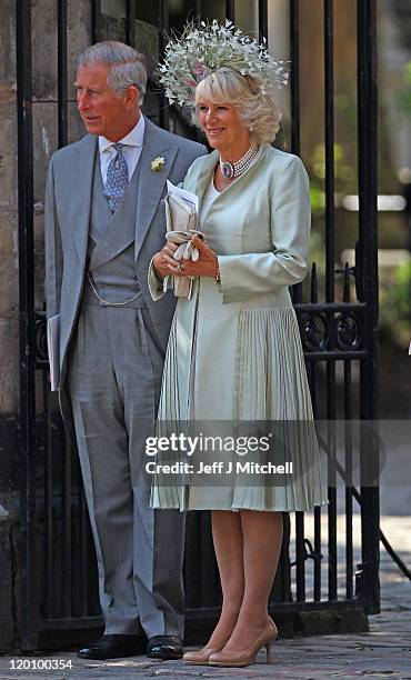 Prince Charles, Prince of Wales and Camilla, Duchess of Cornwall depart from the Royal wedding of Zara Phillips and Mike Tindall at Canongate Kirk on...