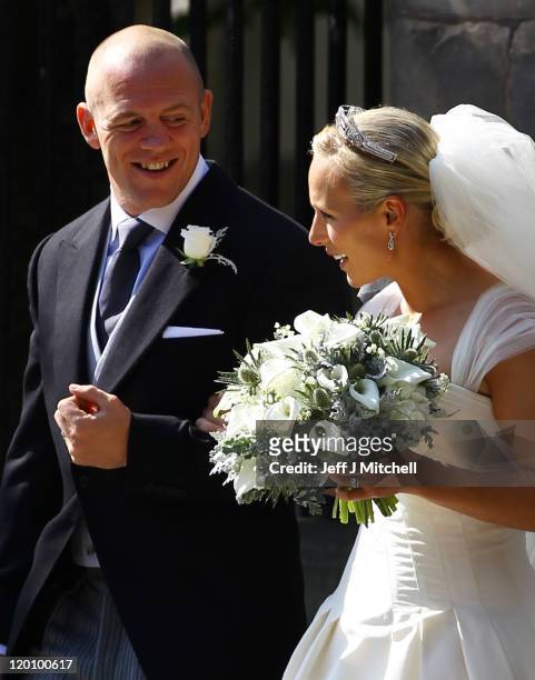 Mike Tindall and Zara Phillips depart after their Royal wedding at Canongate Kirk on July 30, 2011 in Edinburgh, Scotland. The Queen's granddaughter...