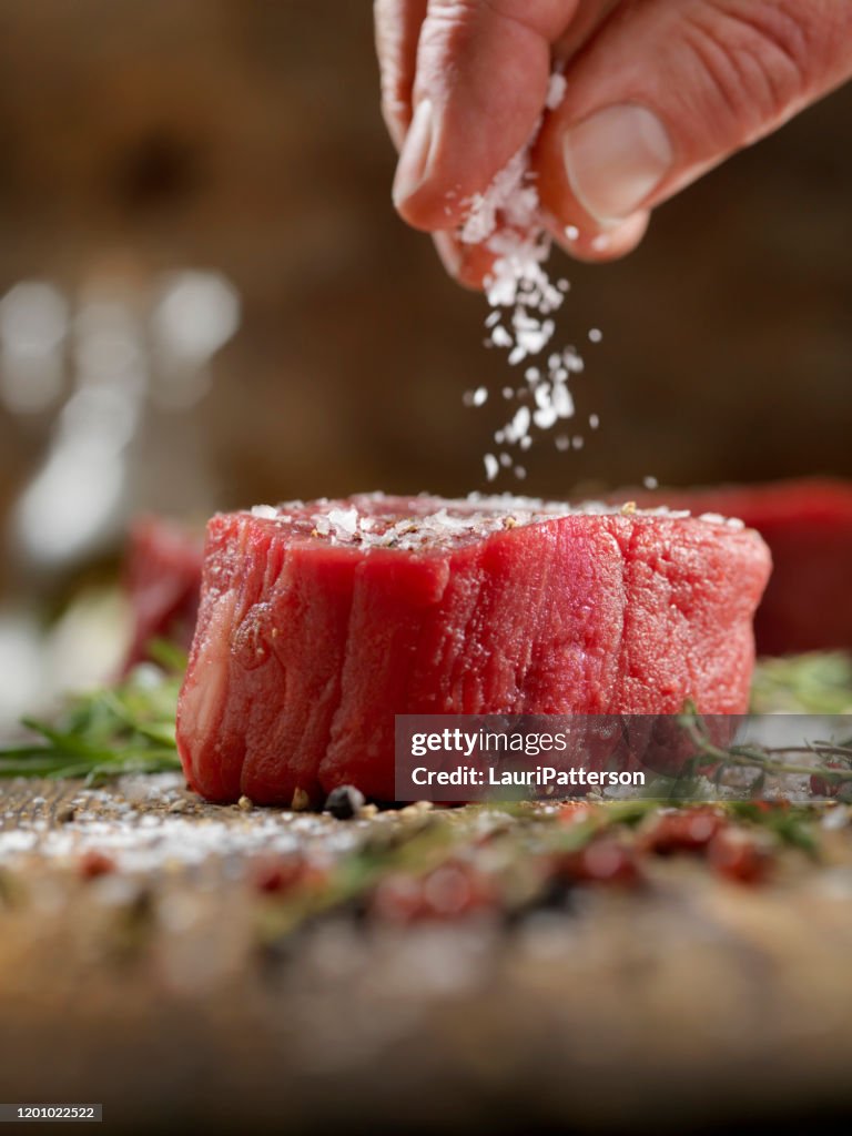 Seasoning Raw Fillet Mignon Steaks