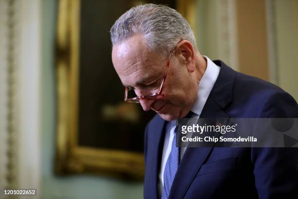 Senate Minority Leader Chuck Schumer walks on the second floor of the U.S. Capitol during a break in the impeachment trial of President Donald Trump...