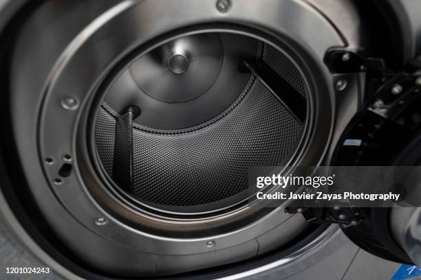 detail of inside a washing machine - drum container stock pictures, royalty-free photos & images