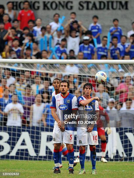 Gael Givet and Mauro Formica deflect a penalty kick from Kitchee during their Barclays Asia Trophy football match at Hong Kong stadium on July 30,...