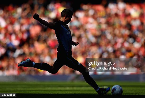 Robin van Persie of Arsenal takes a free kick during the Emirates Cup match between Arsenal and Boca Juniors at the Emirates Stadium on July 30, 2011...