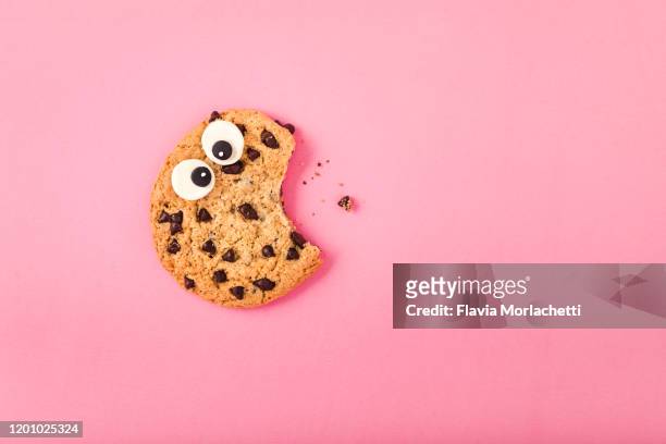 chocolate chip cookie with eyes - crumbs stock pictures, royalty-free photos & images