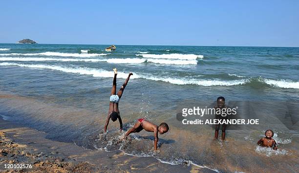 Children play along the Saga beach, at Lake Malawi, on July 17, 2011. Lake Malawi remains unspoilt and one of Malawi's' biggest tourist attractions...