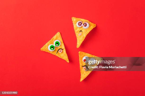 nachos with eyes and moustache - tortilla chip stock-fotos und bilder