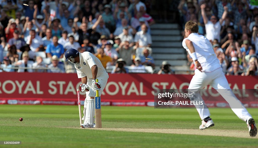 England's Stuart Broad (R) celebrates a