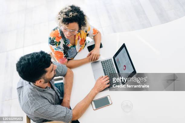 financial advisor - women talking in a bank with computer stock pictures, royalty-free photos & images