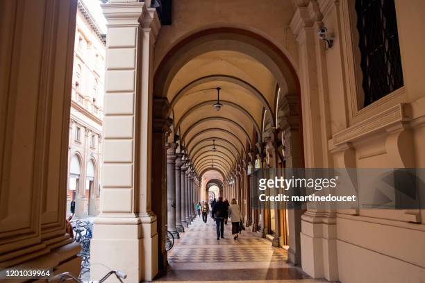 typical portico in the streets of bologna, italy. - colonnato imagens e fotografias de stock