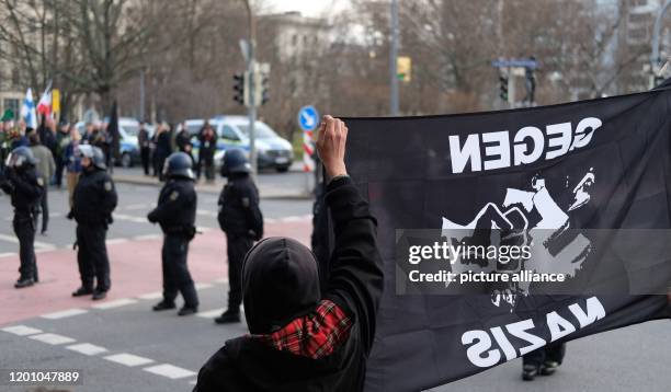 February 2020, Saxony, Dresden: Participants of a protest action against a right-wing march are standing on the edge of a demonstration. The occasion...