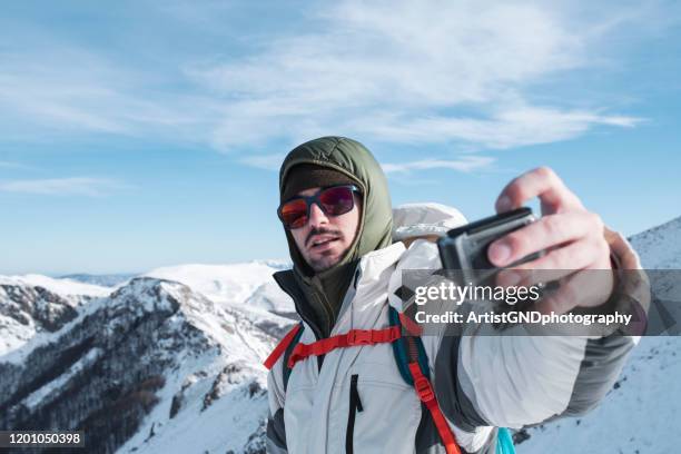 hiker doing selfie with action camera - wearable camera stock pictures, royalty-free photos & images