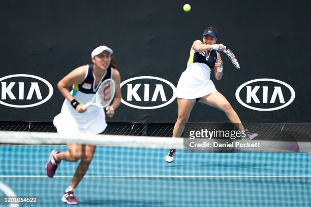 Hao-Ching Chan and Latisha Chan of Taiwan plays during their Women's Doubles first round match against Oksana Kalashnikova of Georgia and Miyu Kato...