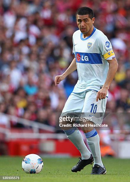 Juan Roman Riquelme of Boca Juniors runs with the ball during the Emirates Cup match between Arsenal and Boca Juniors at the Emirates Stadium on July...