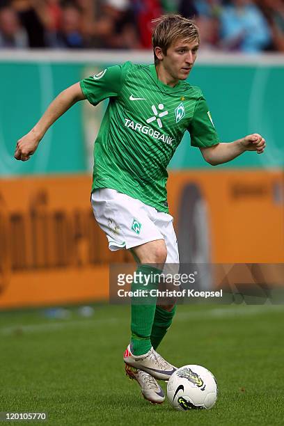 Marko Marin of Bremen runs with the ball during the first round DFB Cup match between 1. FC Heidenheim and Werder Bremen at Voith-Arena on July 30,...