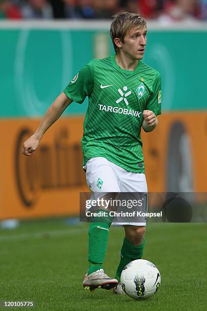 Marko Marin of Bremen runs with the ball during the first round DFB Cup match between 1. FC Heidenheim and Werder Bremen at Voith-Arena on July 30,...