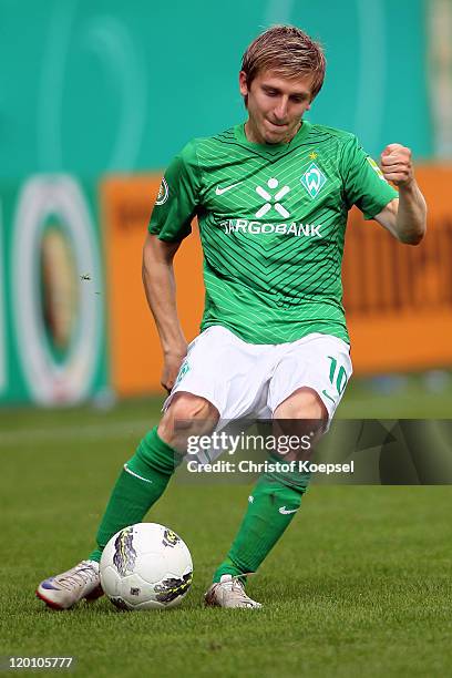 Marko Marin of Bremen runs with the ball during the first round DFB Cup match between 1. FC Heidenheim and Werder Bremen at Voith-Arena on July 30,...