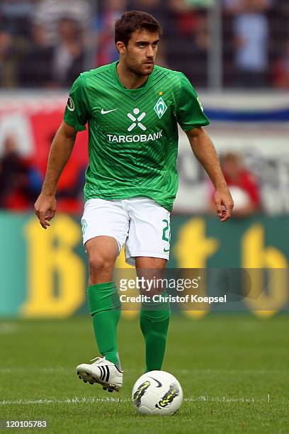 Sokratis Papastathopoulos of Bremen runs with the ball during the first round DFB Cup match between 1. FC Heidenheim and Werder Bremen at Voith-Arena...