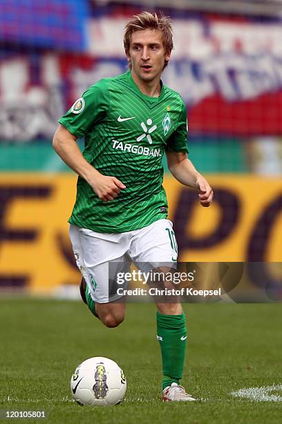 Marko Marin of Bremen runs with the ball during the first round DFB Cup match between 1. FC Heidenheim and Werder Bremen at Voith-Arena on July 30,...