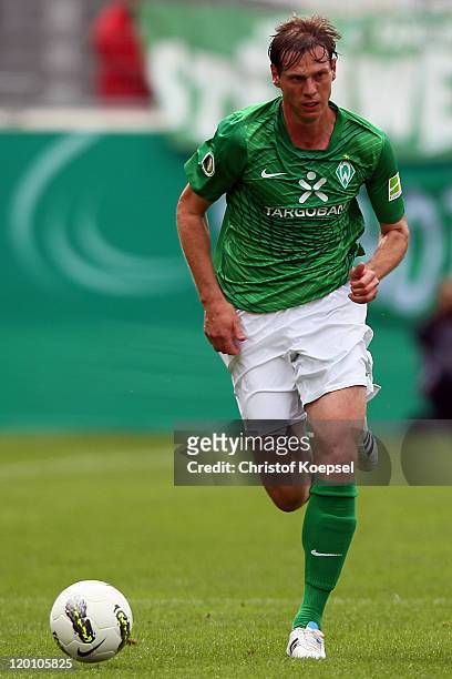 Tim Borowski of Bremen runs with the ball during the first round DFB Cup match between 1. FC Heidenheim and Werder Bremen at Voith-Arena on July 30,...