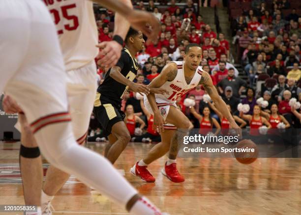 Ohio State Buckeyes guard CJ Walker dribbles the ball while being guarded by Purdue Boilermakers guard Isaiah Thompson during the game between the...