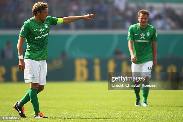 Clemens Fritz of Bremen issues instructions during the first round DFB Cup match between 1. FC Heidenheim and Werder Bremen at Voith-Arena on July...