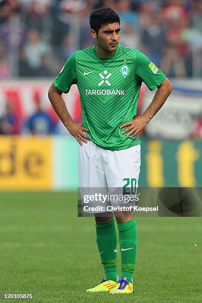 Mehmet Ekici of Bremen looks on during the first round DFB Cup match between 1. FC Heidenheim and Werder Bremen at Voith-Arena on July 30, 2011 in...