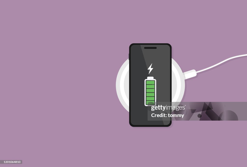 The mobile phone has a full battery on a wireless charger
