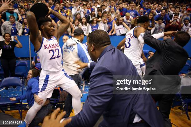 Silvio De Sousa of the Kansas Jayhawks picks up a chair during a brawl as the game against the Kansas State Wildcats ends at Allen Fieldhouse on...