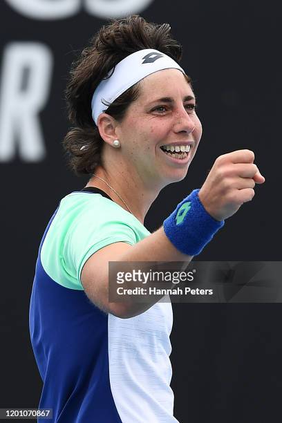 Carla Suarez Navarro of Spain celebrates after winning match point during her Women's Singles first round match against Aryna Sabalenka of Belarus on...