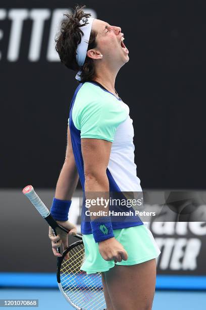 Carla Suarez Navarro of Spain celebrates after winning match point during her Women's Singles first round match against Aryna Sabalenka of Belarus on...