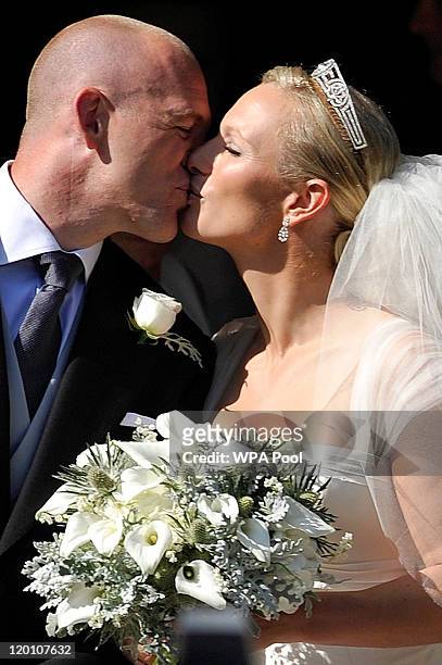 England rugby captain Mike Tindall and Zara Phillips kiss as they leave the church after their marriage at Canongate Kirk on July 30, 2011 in...
