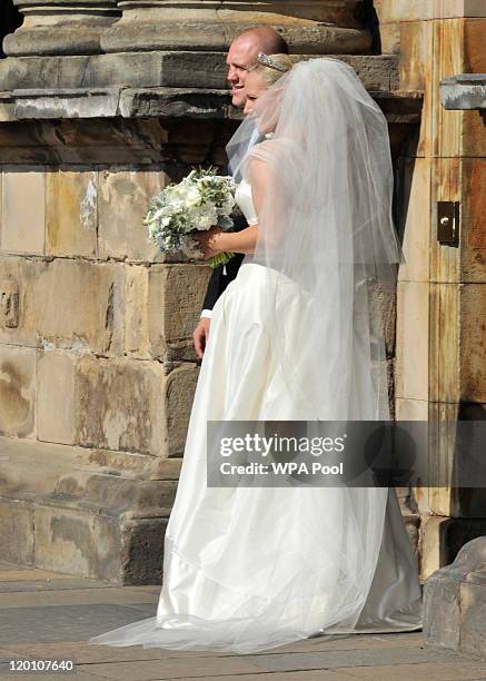 Zara Phillips and Mike Tindall arrive back at the Palace of Holyroodhouse after the Royal wedding at Canongate Kirk on July 30, 2011 in Edinburgh,...