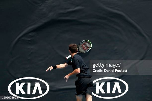 Juan Ignacio Londero of Argentina throws his racquet during his Men's Doubles first round match against Marcelo Arevalo of El Salvador and Jonny...