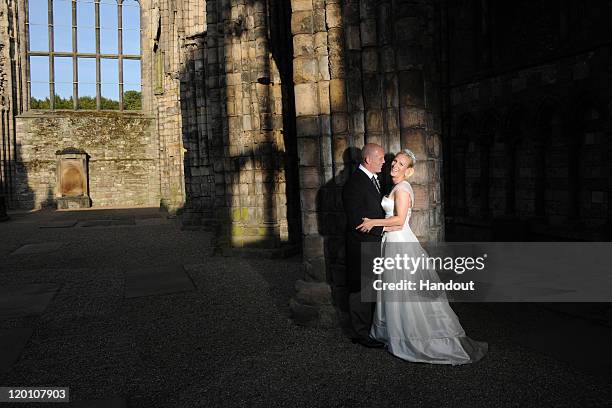 In this handout image supplied by Zara Phillips and Mike Tindall, England rugby captain Mike Tindall and Zara Phillips are pictured in Holyrood...