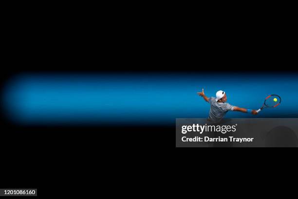 Tatsuma Ito of Japan plays a backhand during his Men's Singles second round match against Novak Djokovic of Serbia on day three of the 2020...