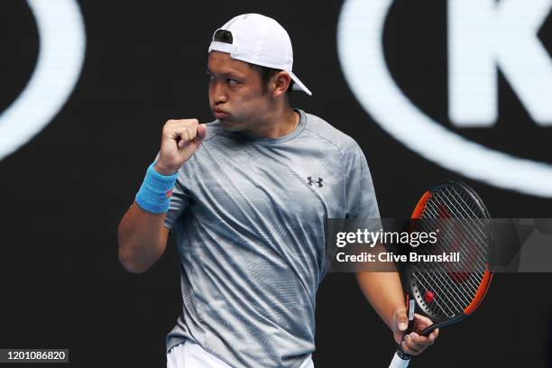 Tatsuma Ito of Japan celebrates after winning a point during his Men's Singles second round match against Novak Djokovic of Serbia on day three of...