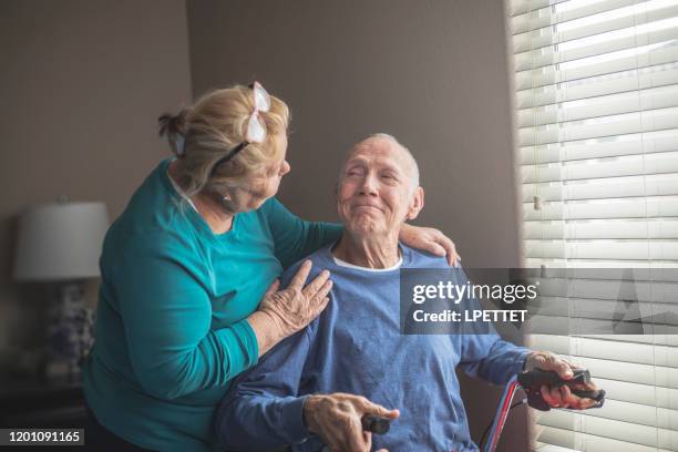 at home care giver - palliative care stock pictures, royalty-free photos & images