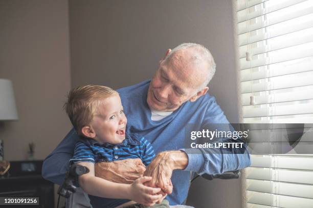 grandfather and grandson - parkinsons disease stock pictures, royalty-free photos & images